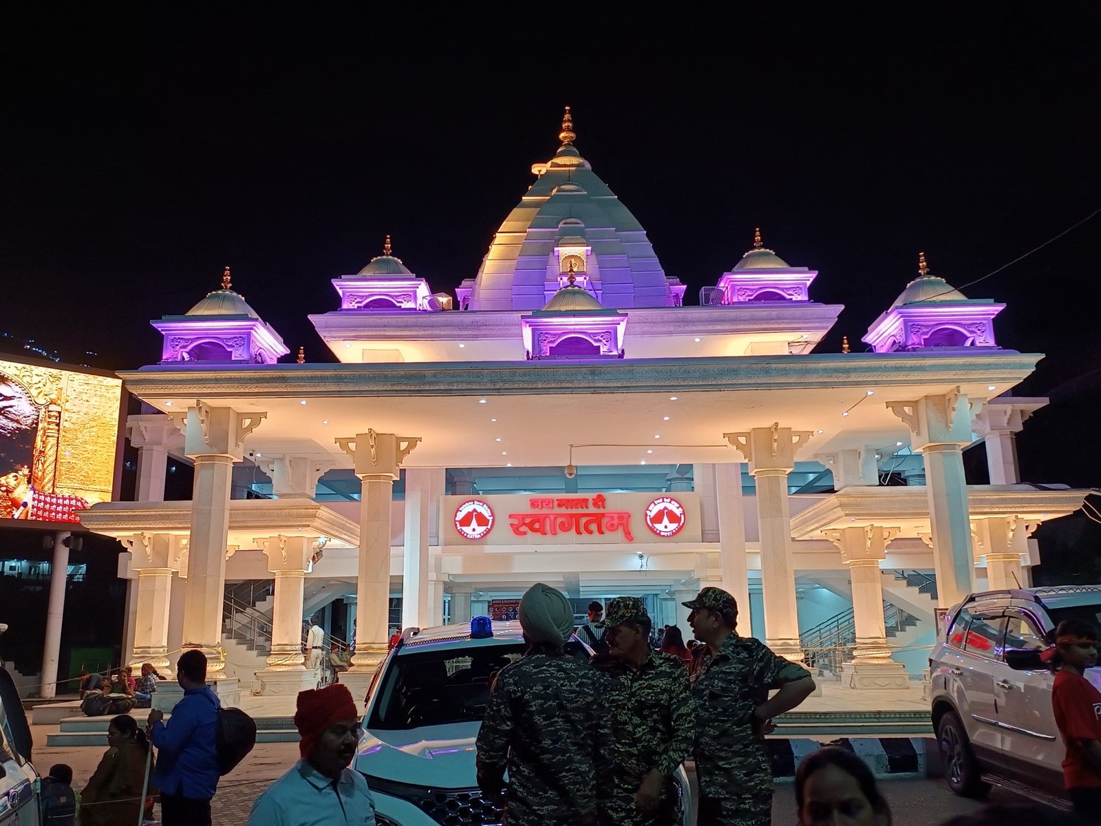Illuminated Mata Vaishno Devi entrance at night — Jai Mata Di Swagatam